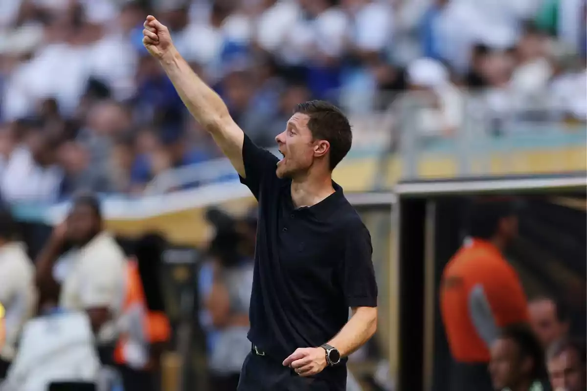 Soccer coach giving instructions on the sideline during a match