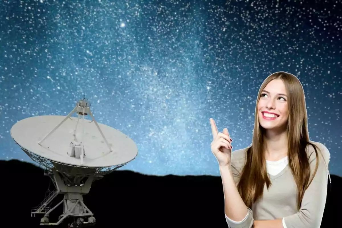 Smiling woman pointing at the starry sky next to a satellite dish Smiling woman pointing at the starry sky next to a satellite dish