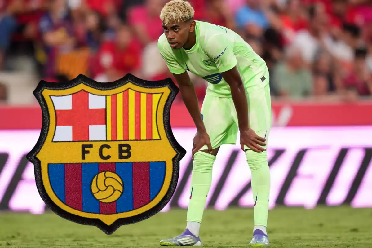 Soccer player in a fluorescent green uniform on the field next to the FC Barcelona crest