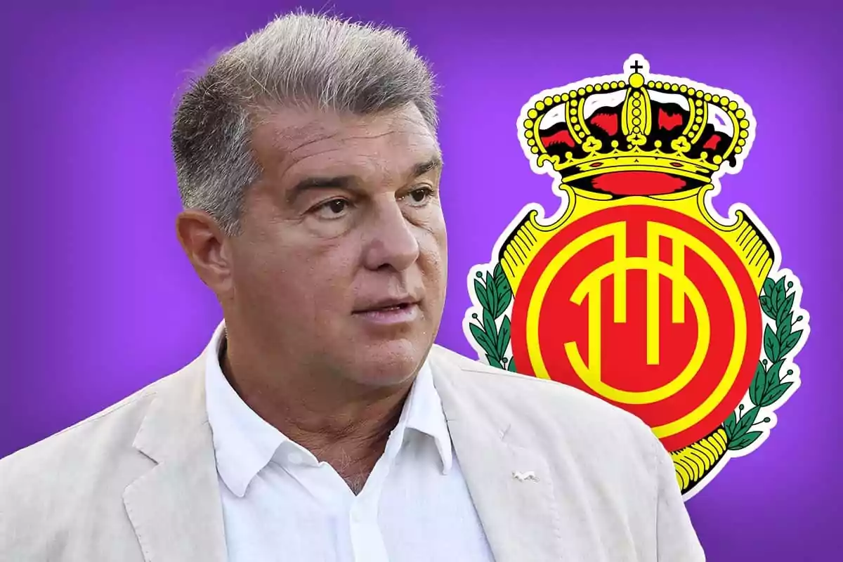 Gray-haired man in a light jacket in front of the Mallorca football club crest against a purple background