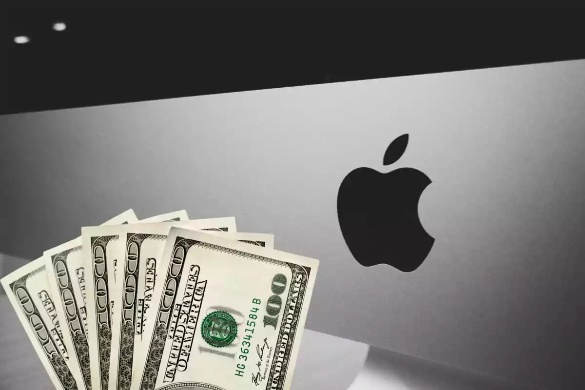 Hundred-dollar bills in front of an Apple computer