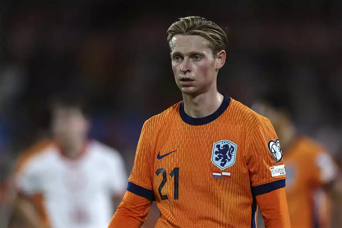 Soccer player wearing the orange uniform of the Netherlands national team during a match Soccer player wearing the orange uniform of the Netherlands national team during a match