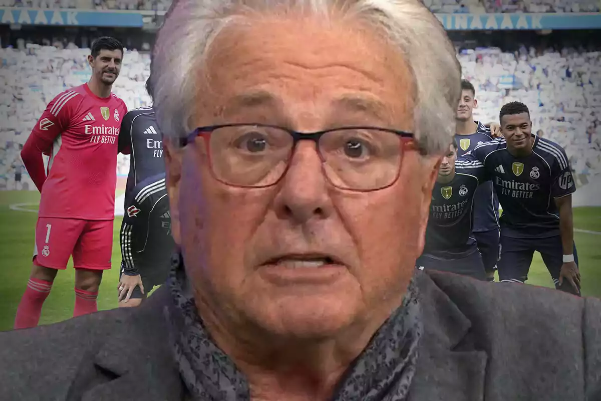 A gray-haired man with glasses appears in the foreground with a serious expression, while several Real Madrid players can be seen in the background on the field.