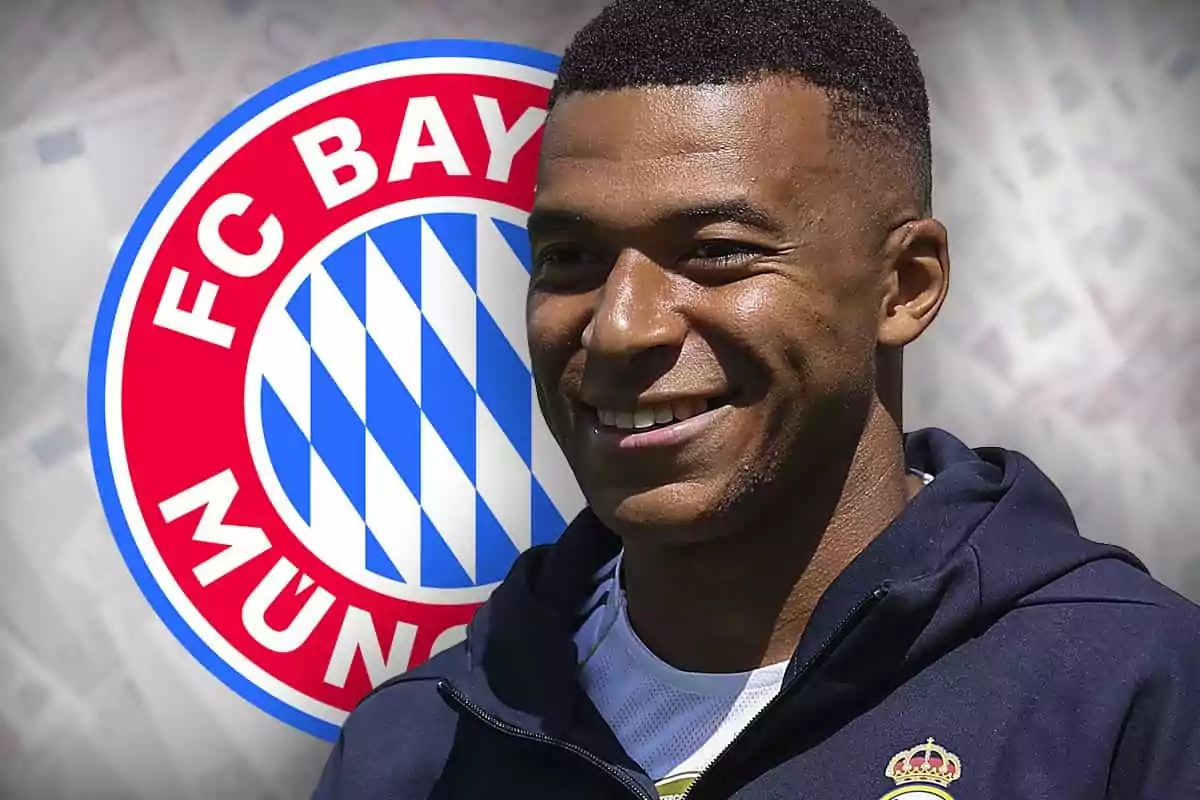 A smiling player with the Bayern Munich crest in the background