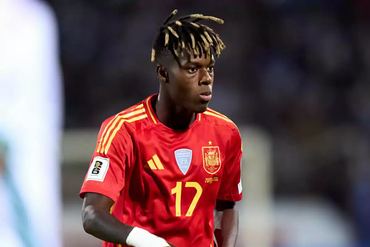 Soccer player wearing the red uniform of the Spanish national team during a match Soccer player wearing the red uniform of the Spanish national team during a match