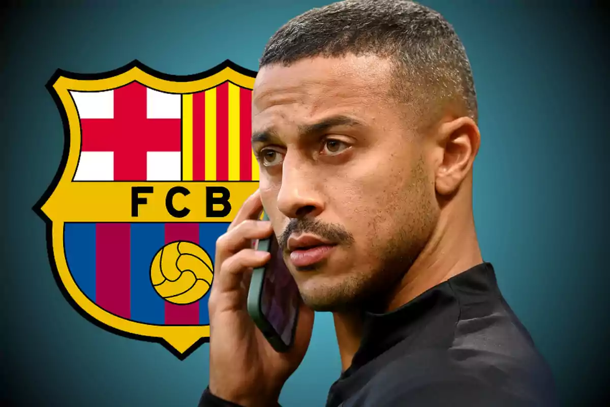 Man talking on the phone with the FC Barcelona crest in the background