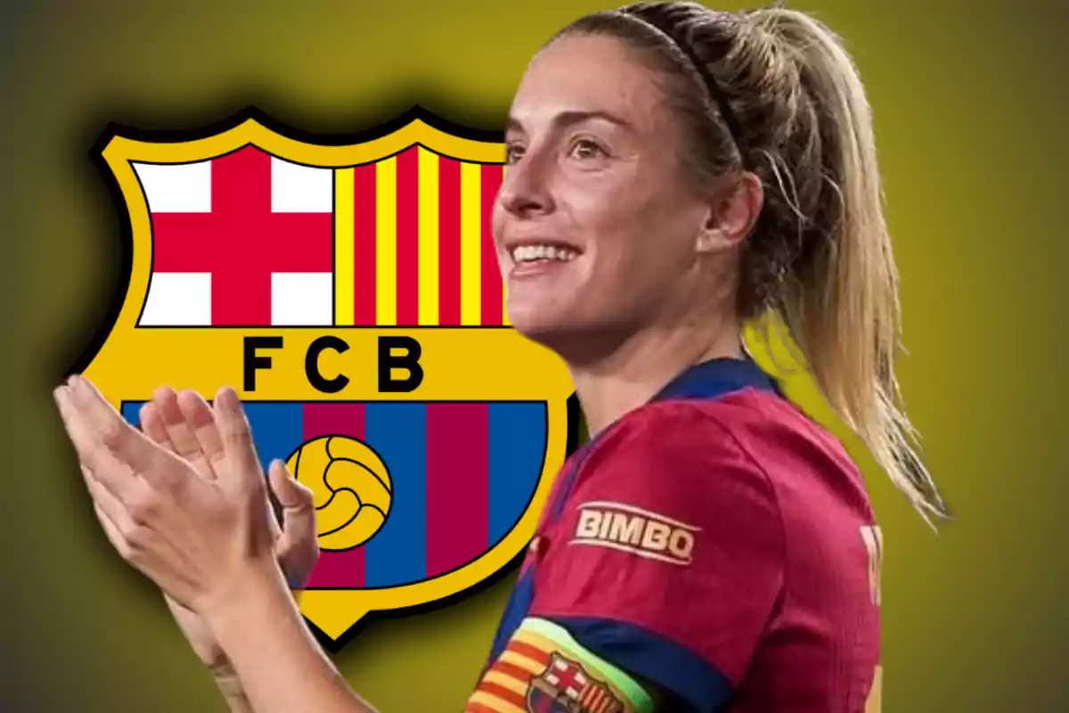 Una jugadora de fútbol aplaudiendo con el escudo del FC Barcelona de fondo.