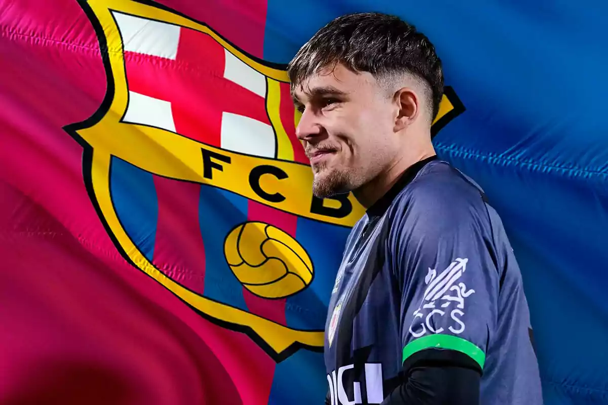 A player in a dark jersey is in profile in front of an FC Barcelona flag.