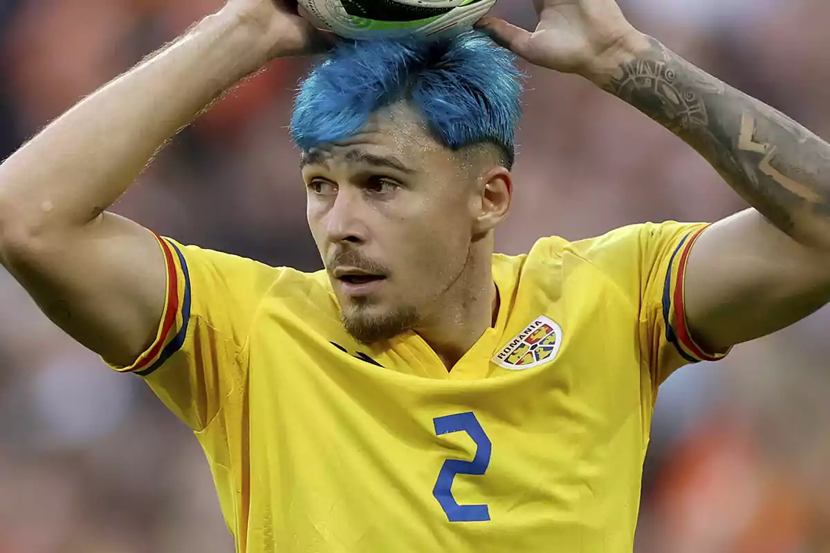 Andrei Ratiu with blue hair preparing to take a throw-in during a match. Andrei Ratiu with blue hair preparing to take a throw-in during a match.