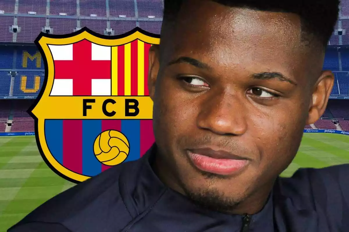 Ansu Fati looking askance at the Barça shield on an image of the Camp Nou