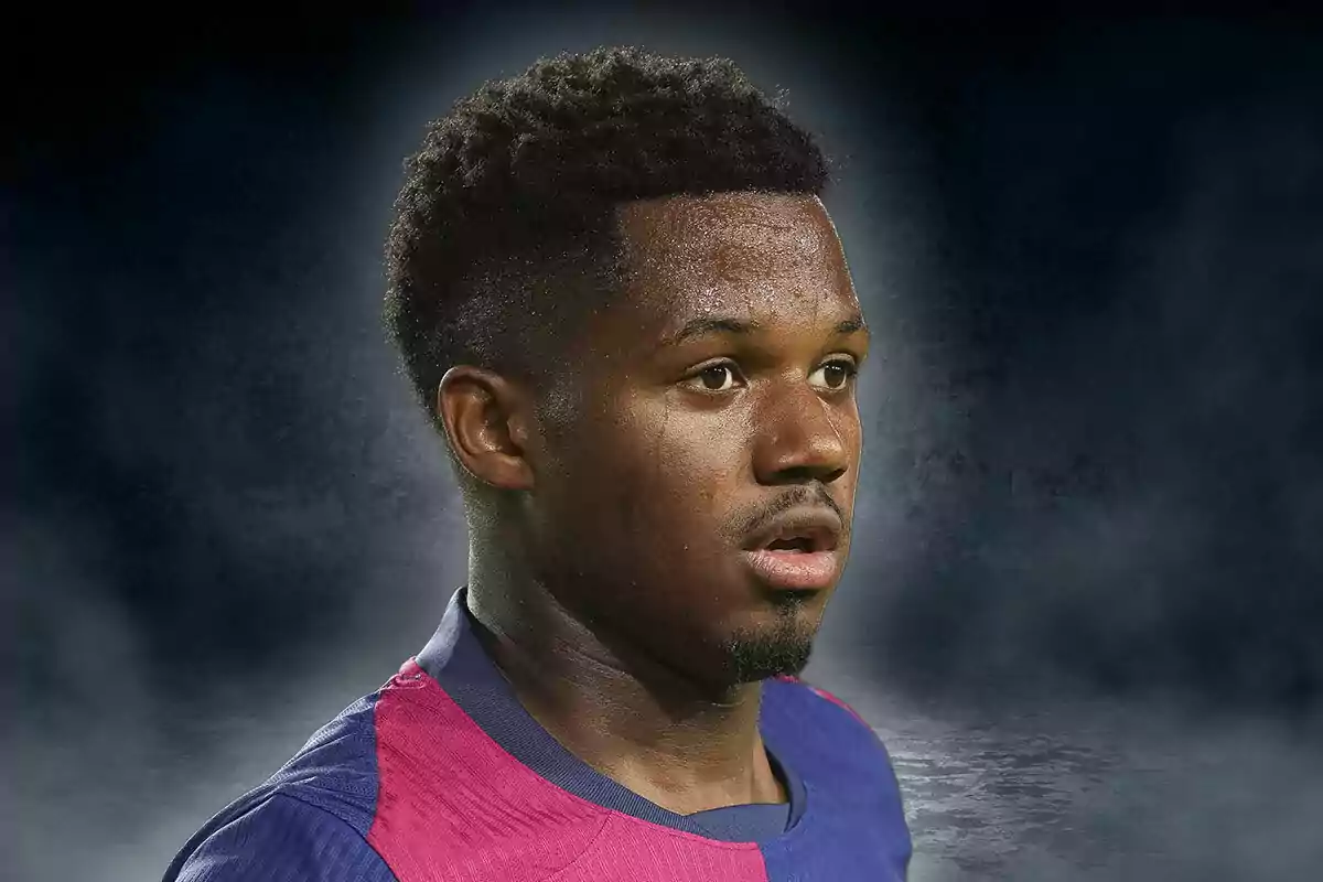 A player in a blue and pink jersey on a dark background.