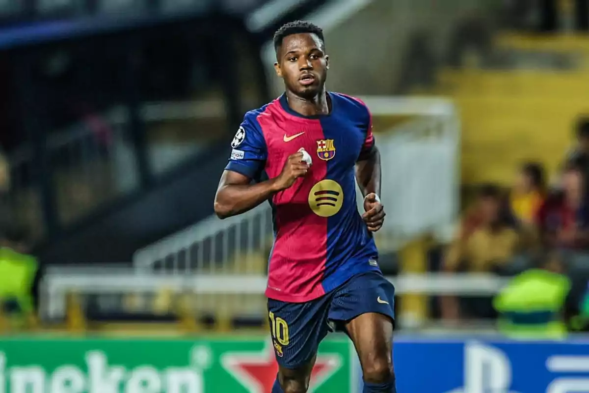soccer player running on the field in FC Barcelona uniform. soccer player running on the field in FC Barcelona uniform.