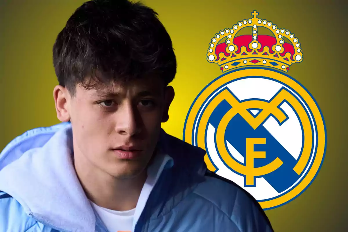 A young man in a light blue jacket in front of the Real Madrid crest on a yellow background.