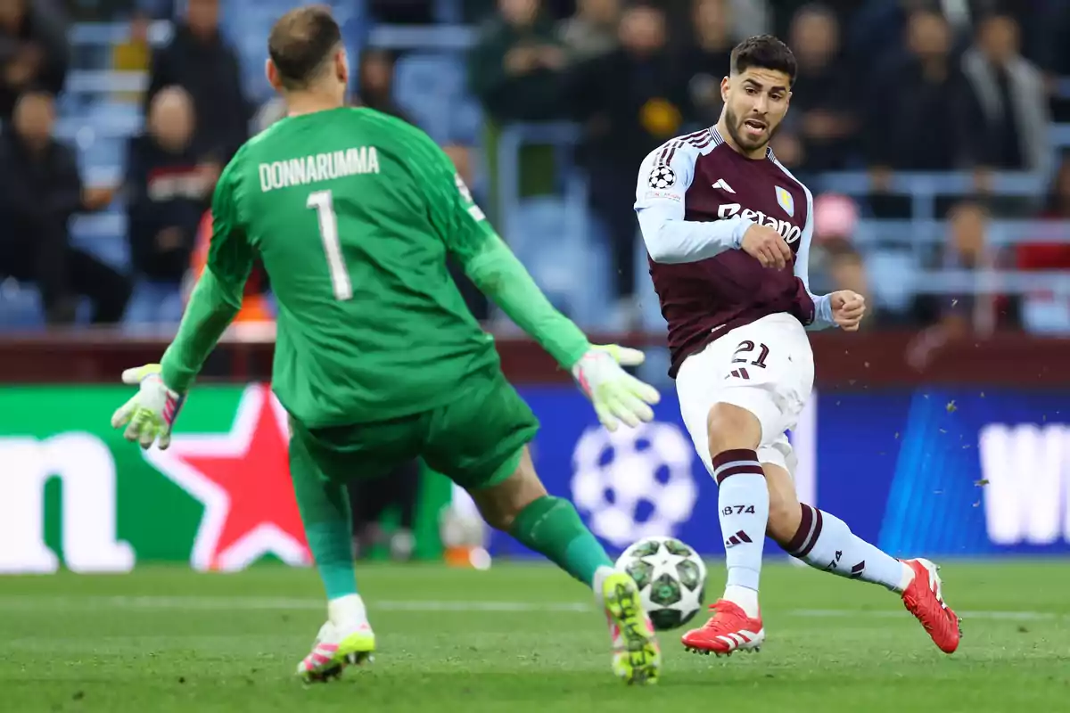 A goalkeeper dressed in green tries to stop a shot from an opposing player during a soccer match. A goalkeeper dressed in green tries to stop a shot from an opposing player during a soccer match.