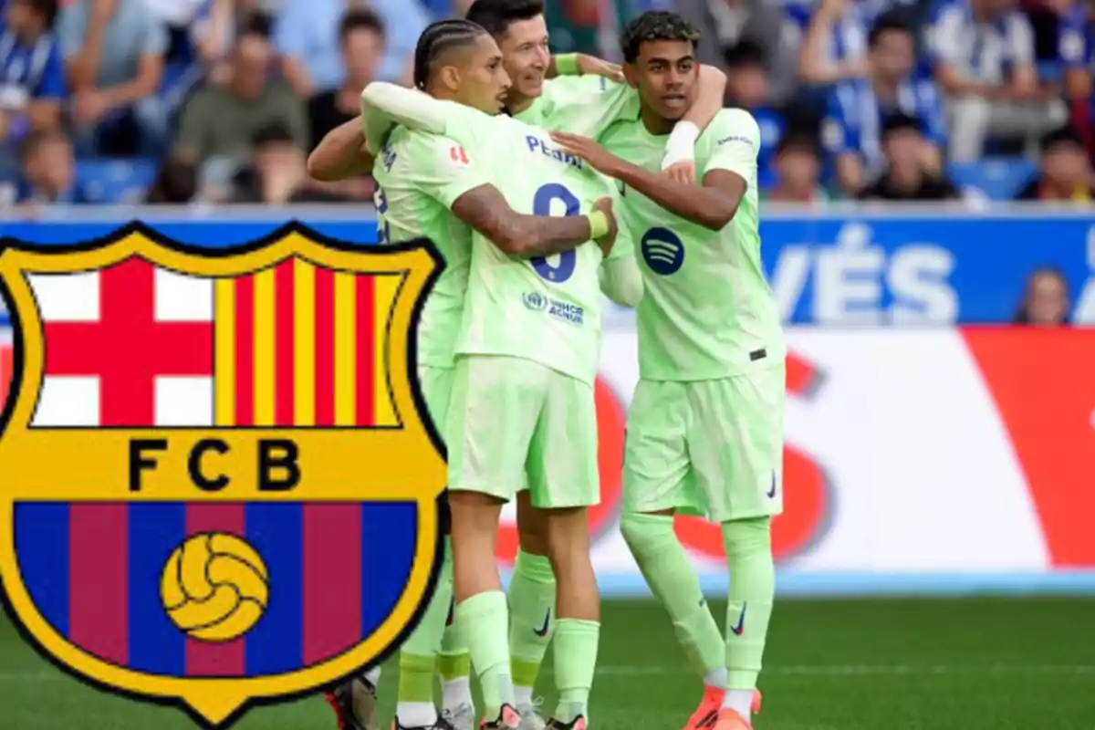 Football players in light green uniforms celebrate on the field next to the FC Barcelona crest.