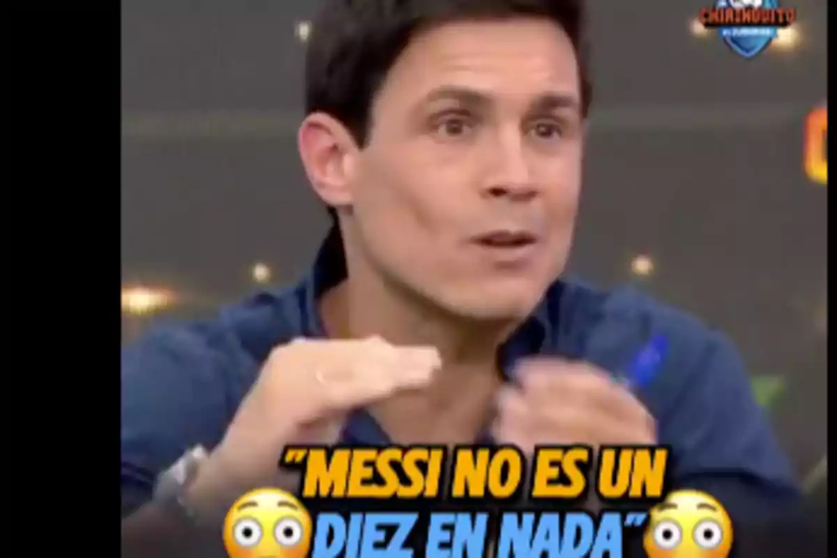 A man speaking on a TV show with the text "Messi is not a ten at anything" at the bottom.