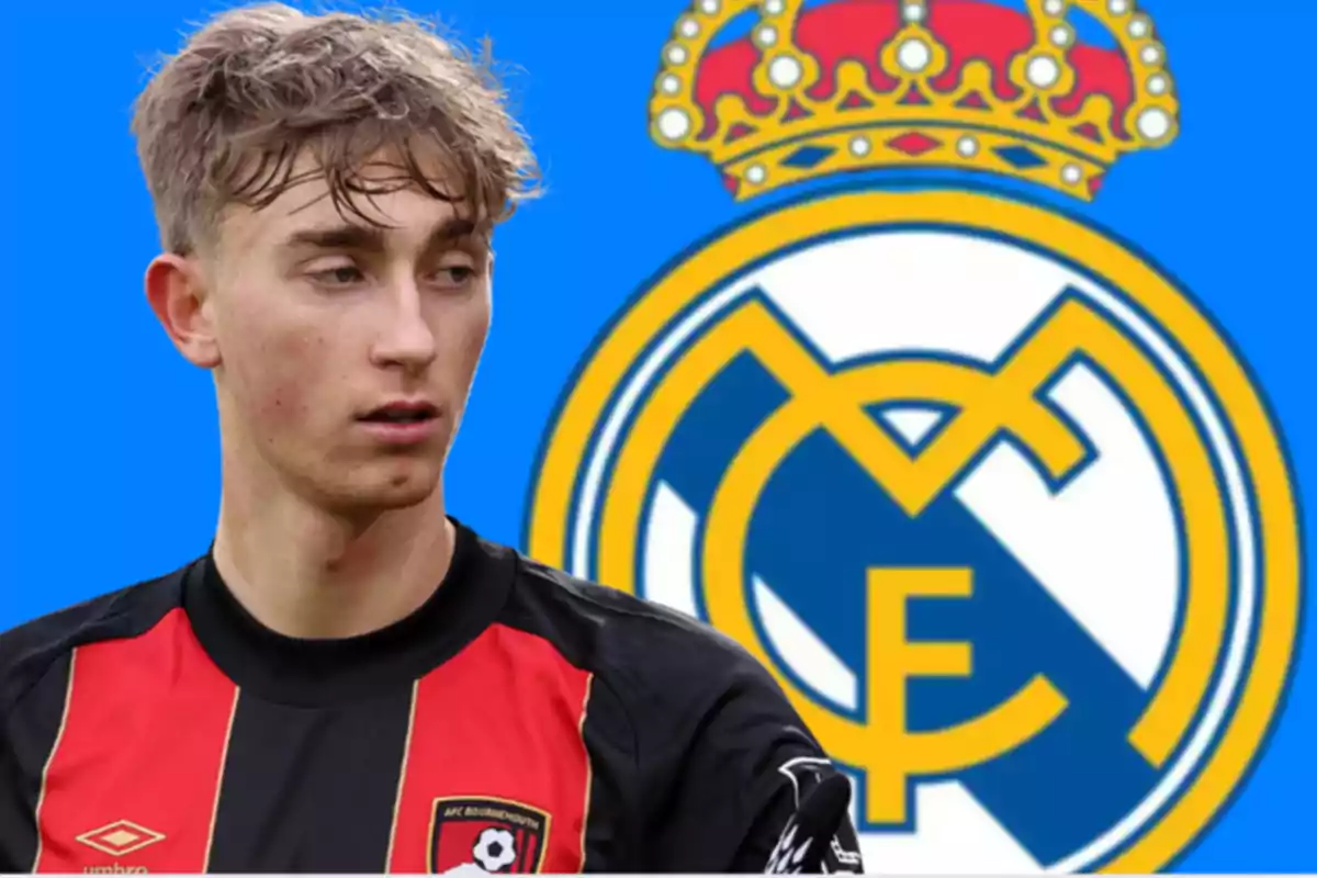 A player in a black and red jersey is in front of a blue background with the Real Madrid crest.