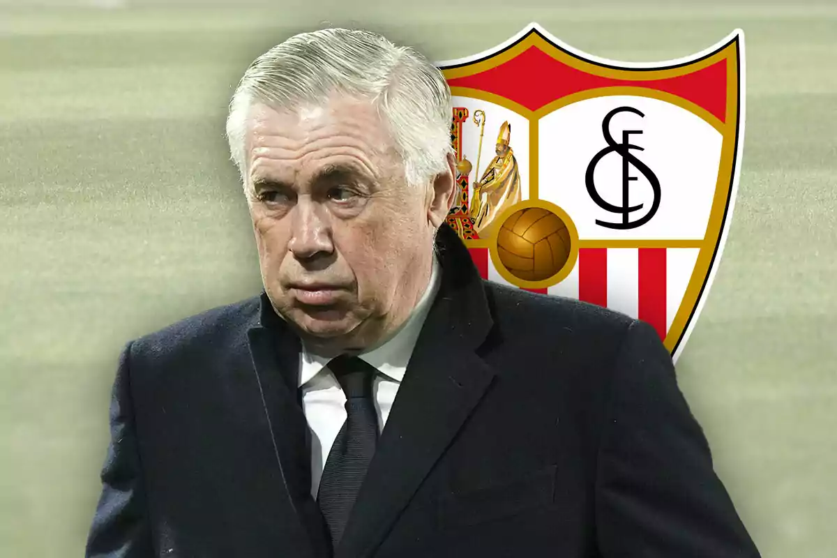 Carlo Ancelotti in a dark coat in front of the Sevilla FC crest.