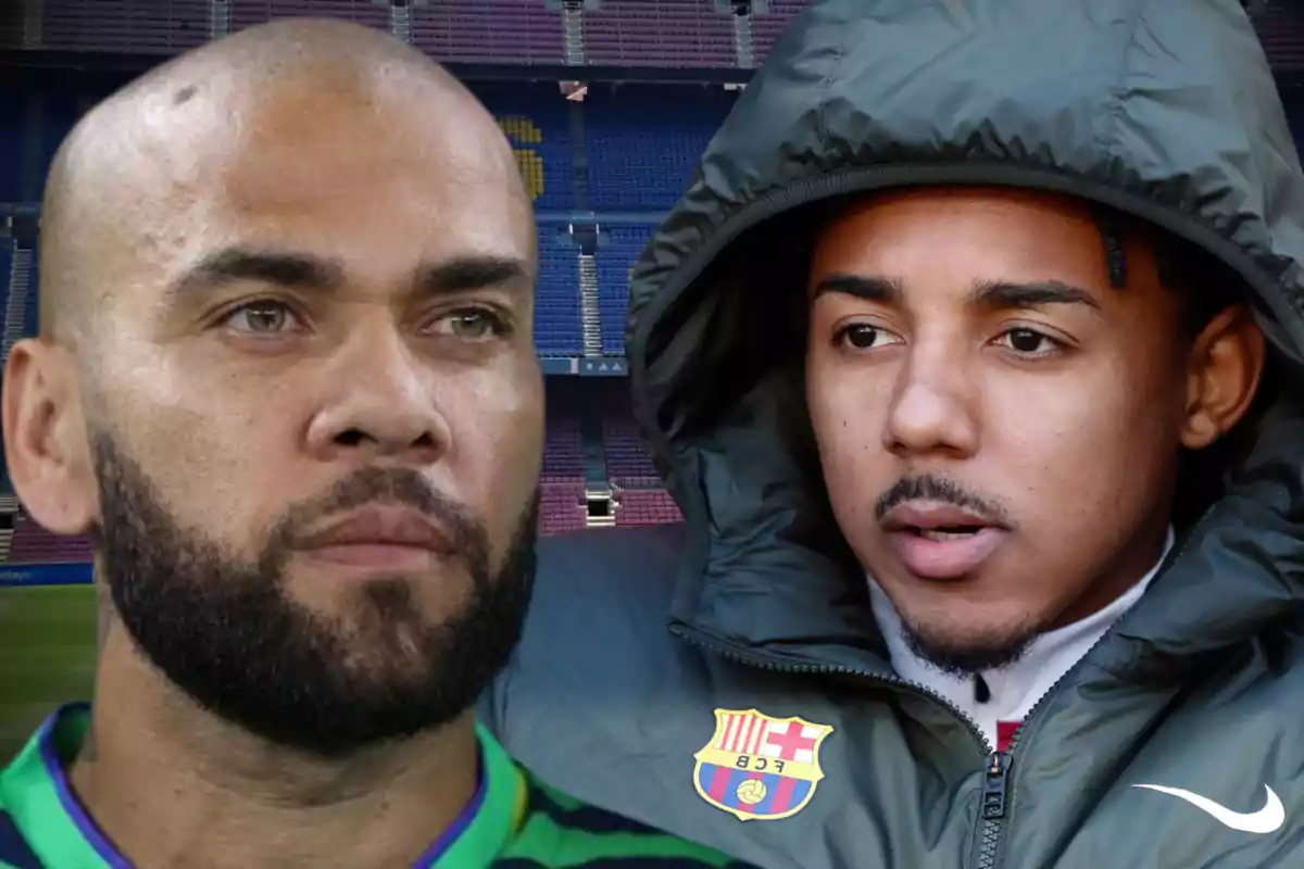 Two men with serious expressions, one with a beard and the other wearing a hooded jacket, in front of a soccer stadium.