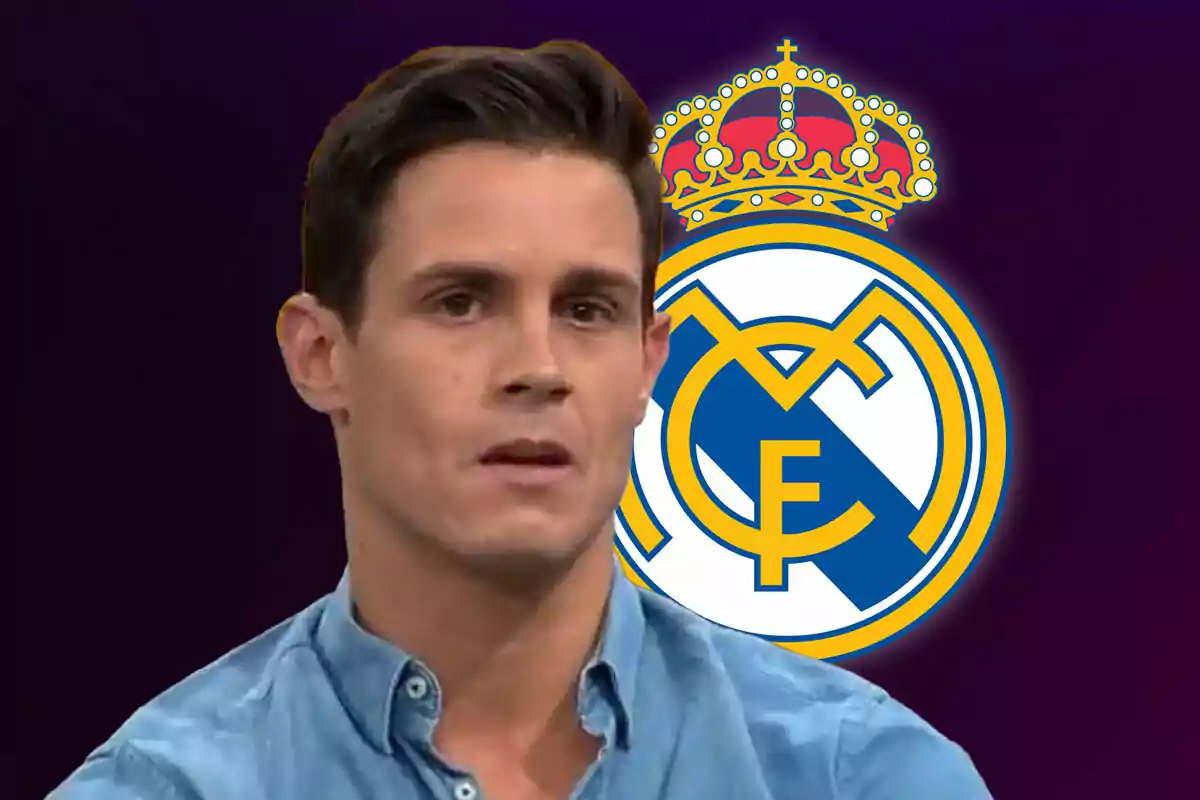 A man in a blue jersey is in front of the Real Madrid crest on a dark background.