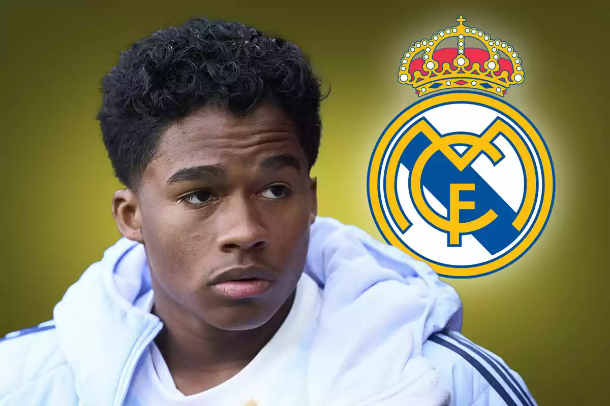 A young man with a white jacket and the Real Madrid crest in the background.