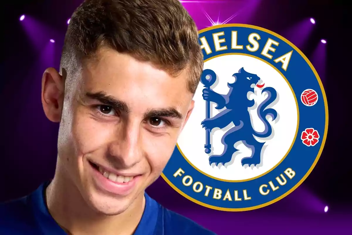 A smiling young man with the Chelsea Football Club logo in the background.