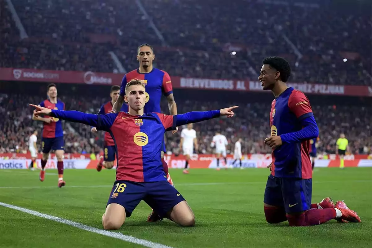 Barcelona players celebrating a goal on the field.