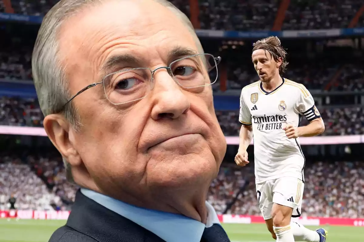 An elderly man with glasses in the foreground and a soccer player running on the field of a stadium full of spectators.