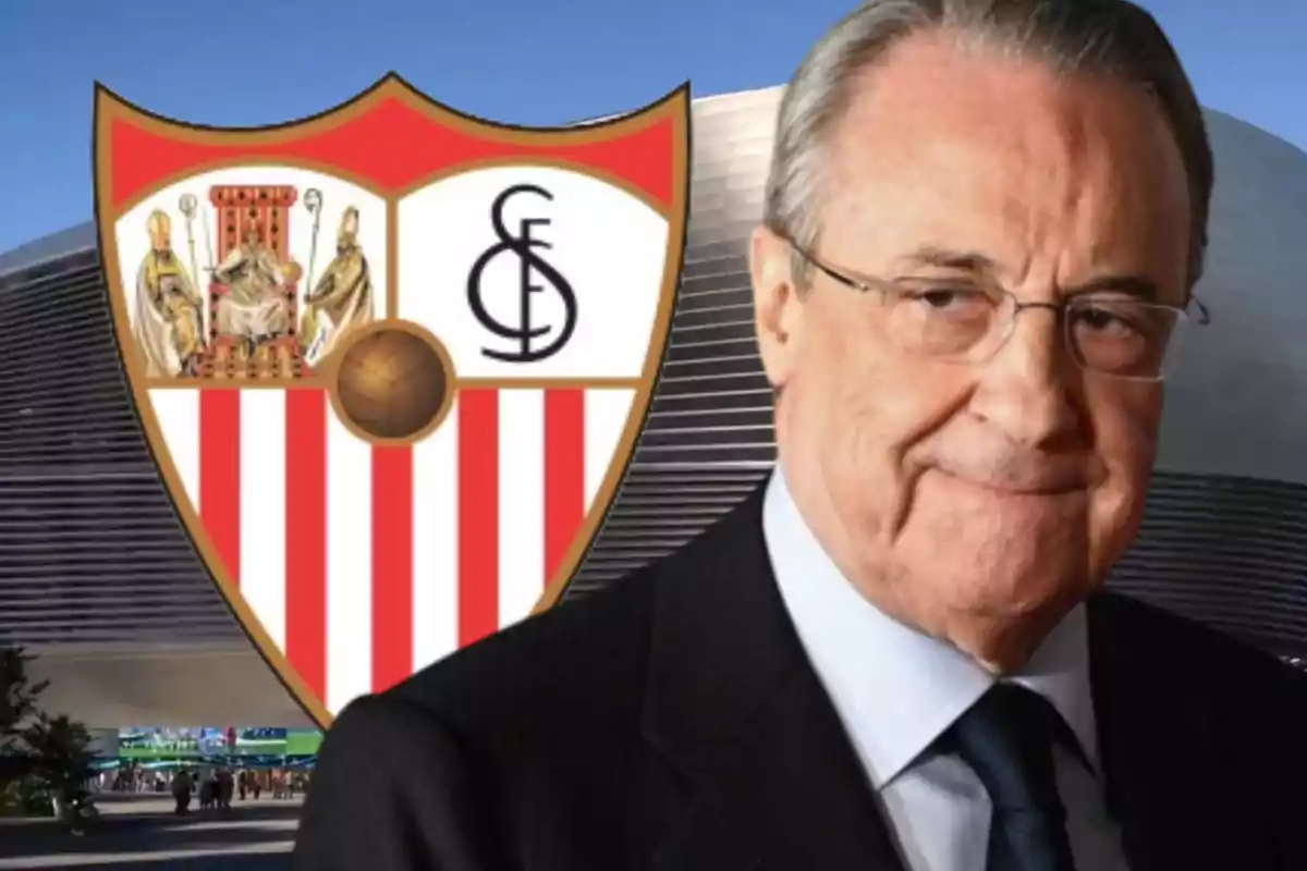 A man with glasses and a suit in front of the Sevilla FC crest.