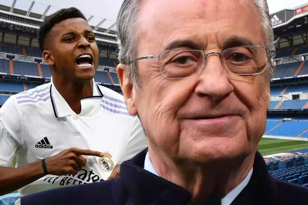 Florentino Pérez con una sonrisa junto a Rodrygo Goes apuntando al escudo del Real Madrid