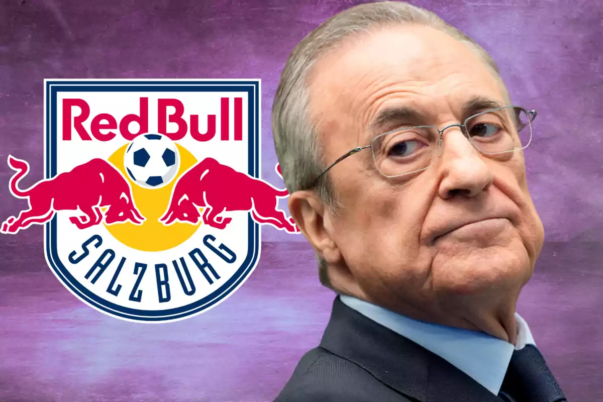 An older man with glasses in front of the Red Bull Salzburg logo on a purple background.