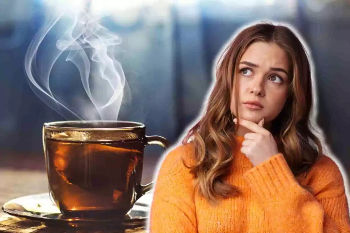 Una mujer pensativa con un suéter naranja junto a una taza de té humeante. Una mujer pensativa con un suéter naranja junto a una taza de té humeante.