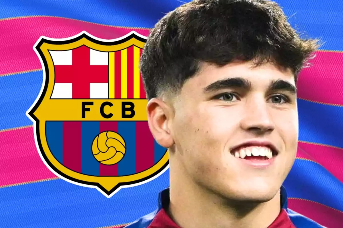 A young man wearing an FC Barcelona shirt smiles in front of a background with the club's shield and a blue and scarlet flag. A young man wearing an FC Barcelona shirt smiles in front of a background with the club's shield and a blue and scarlet flag.