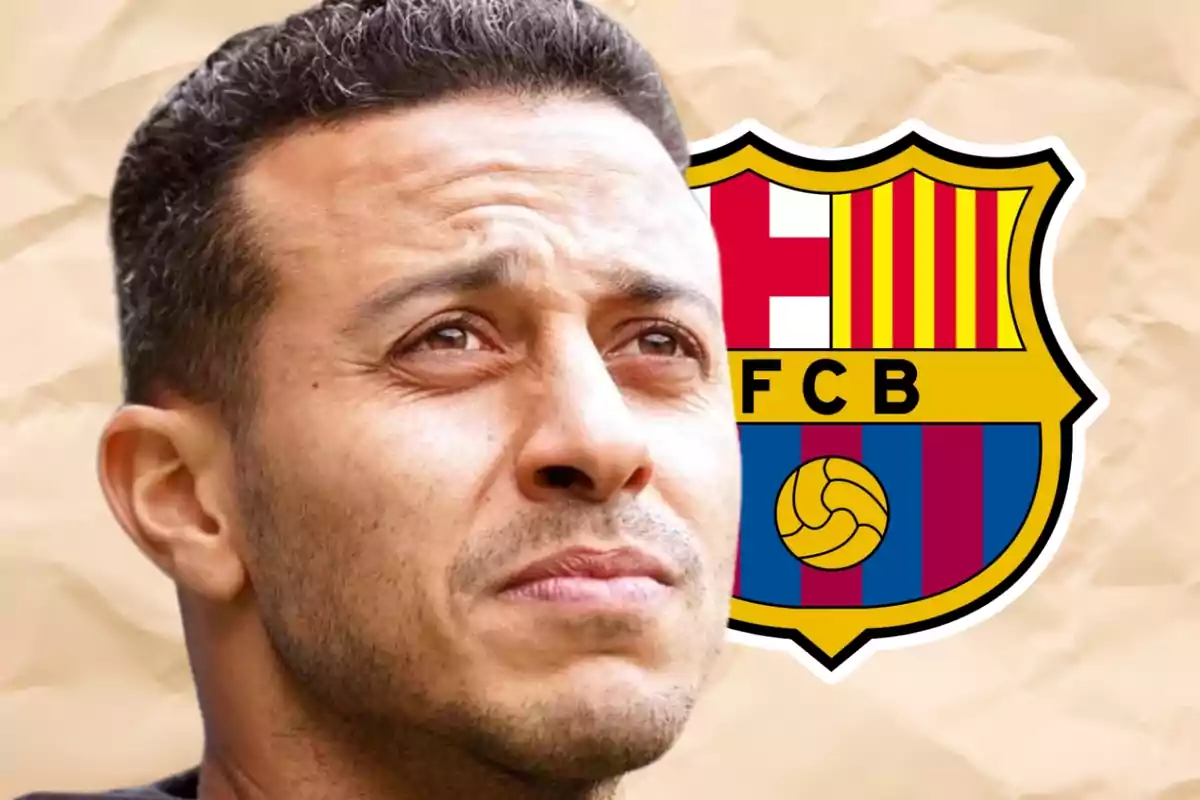 A man looking up with the FC Barcelona logo in the background.