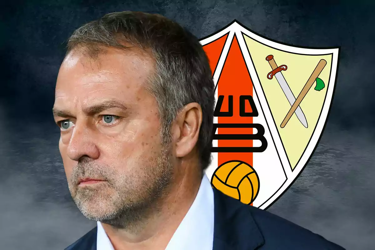 Hansi Flick in profile with a serious expression in front of Barbastro's shield.