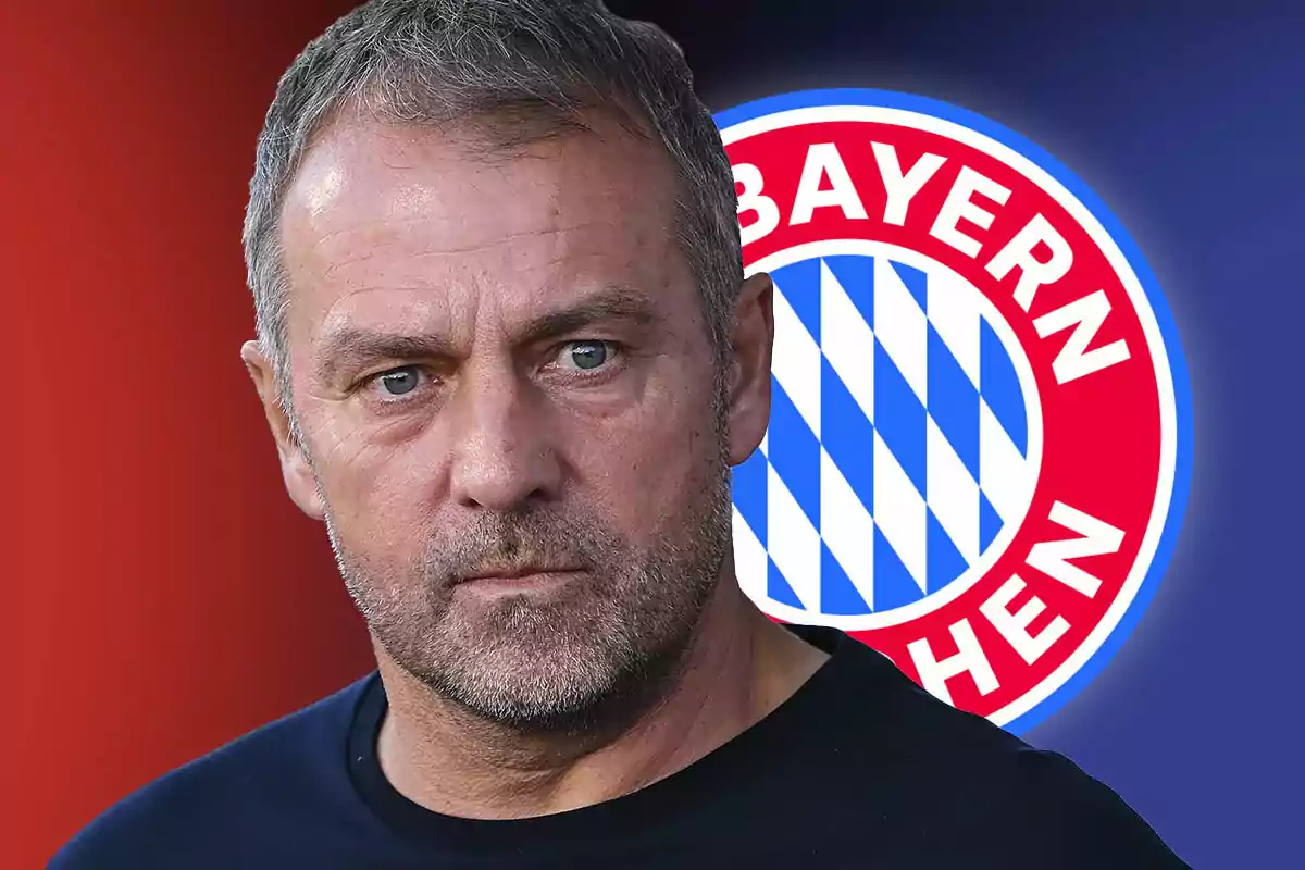 Hansi Flick with serious expression in front of Bayern Munich logo.