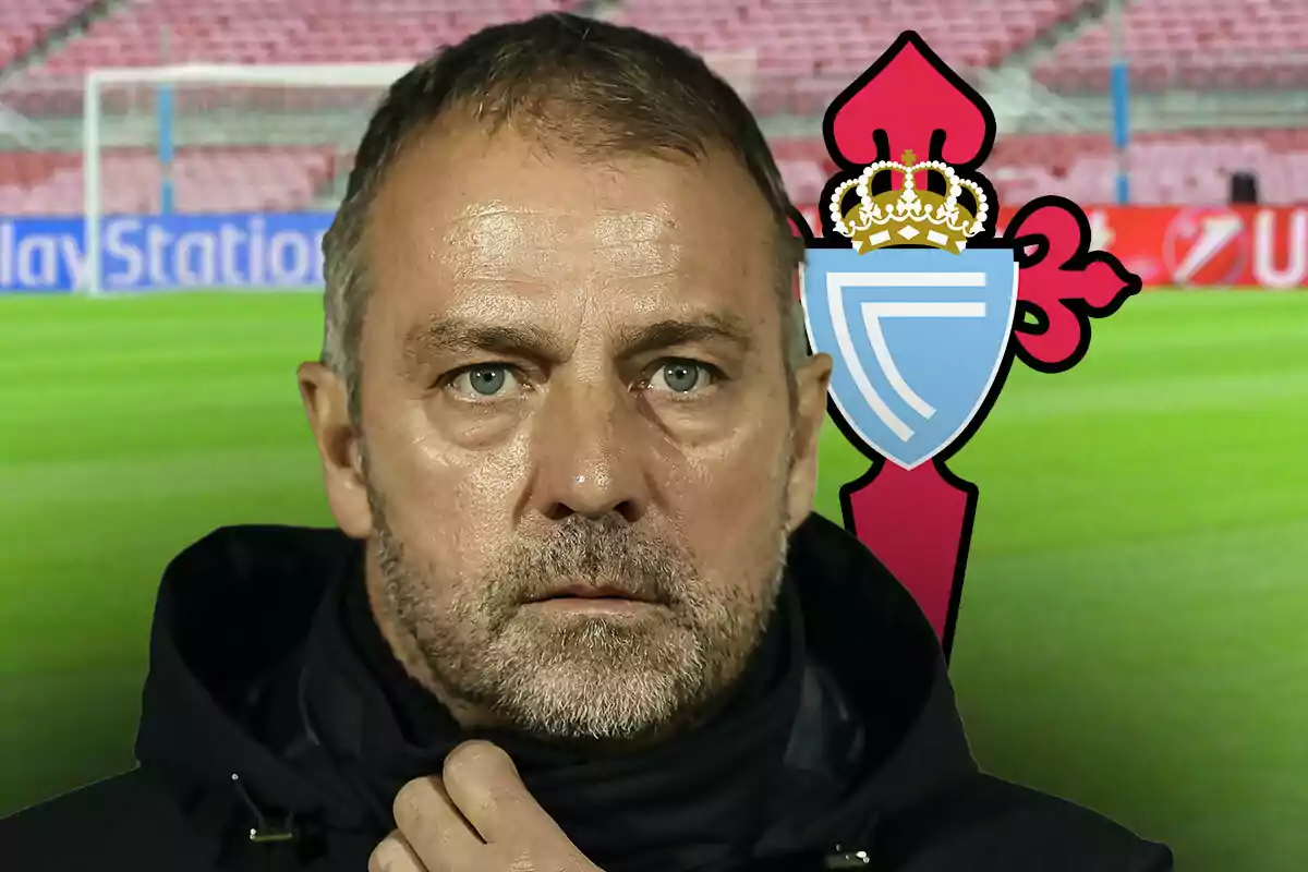 Hansi Flick con expresión seria frente a un campo de fútbol con el escudo del Celta de Vigo al fondo.