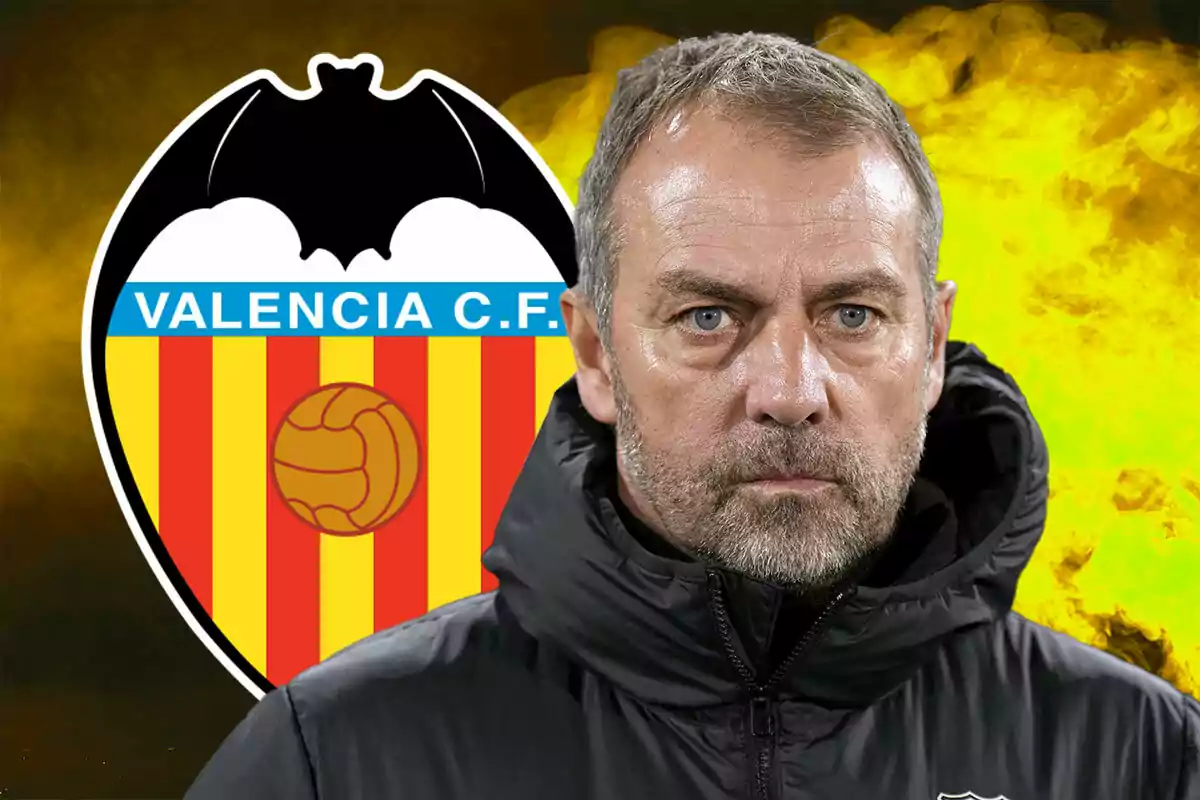 A man in a black jacket in front of the Valencia C.F. crest with a yellow background.