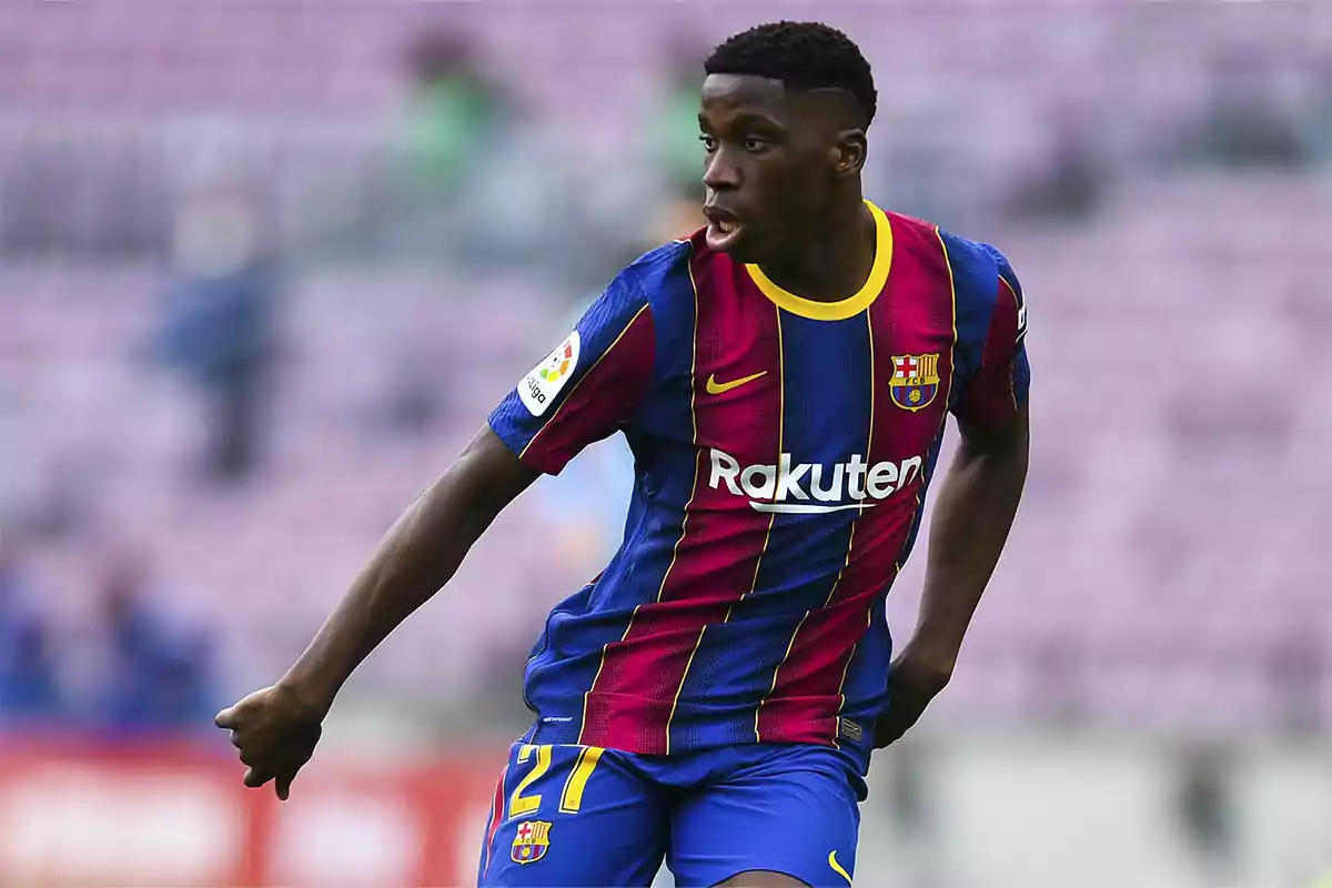 A player in an FC Barcelona uniform on the field.