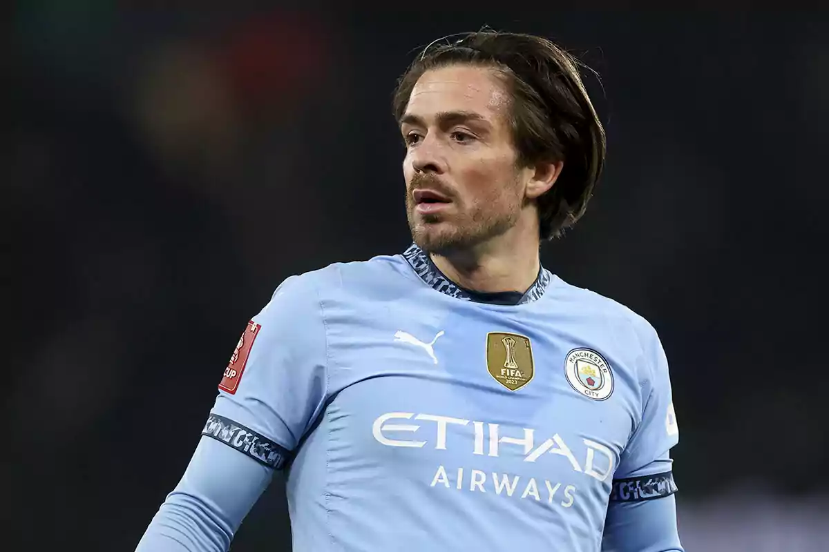 A player in a Manchester City uniform during a match. A player in a Manchester City uniform during a match.
