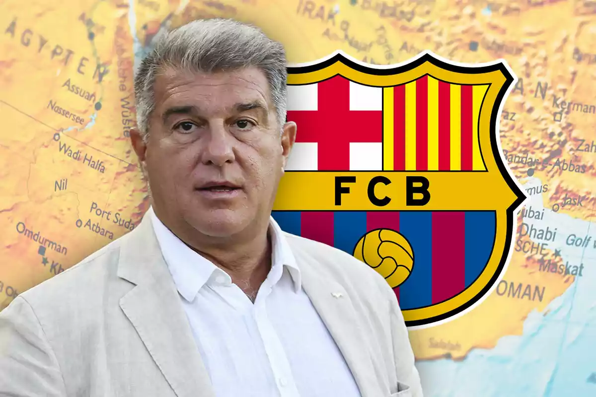 Joan Laporta with grey hair and a light jacket stands in front of an FCB crest and a map in the background.