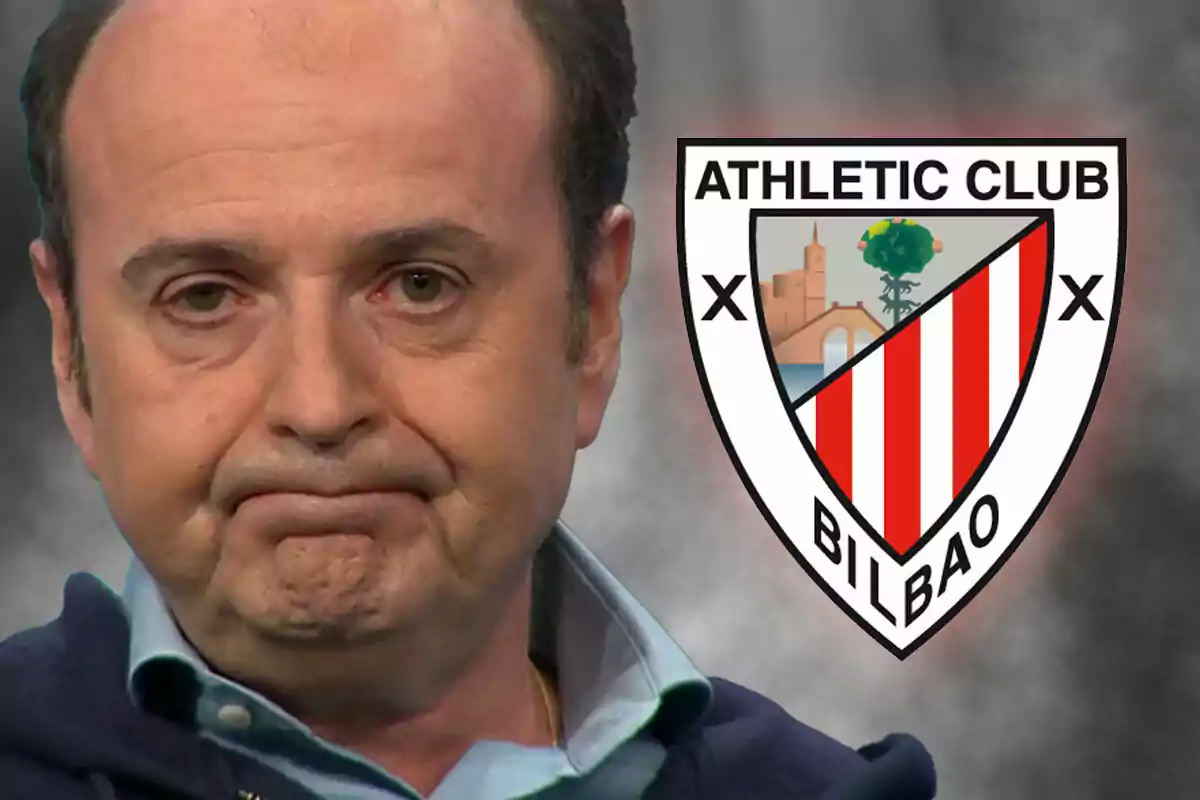 Juanma Rodríguez con expresión seria junto al escudo del Athletic Club de Bilbao.