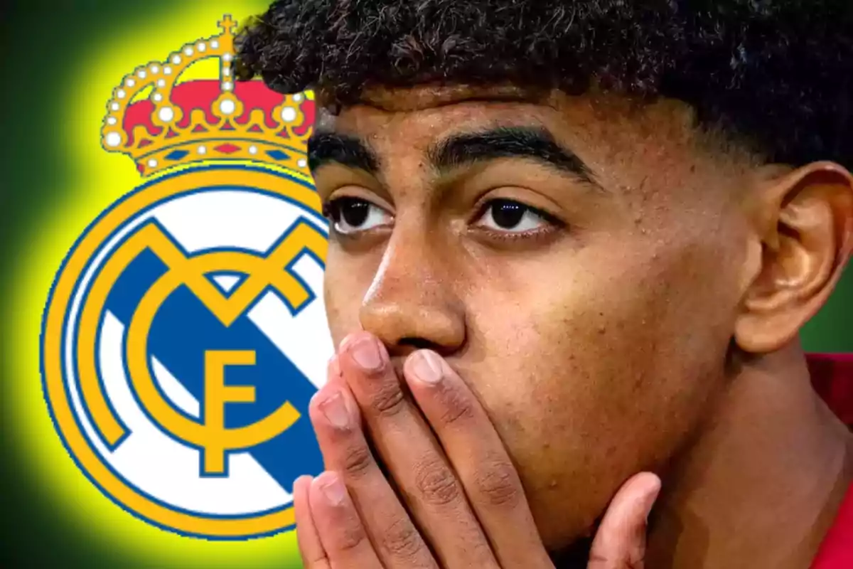 A young man with his hands over his mouth in front of the Real Madrid crest.