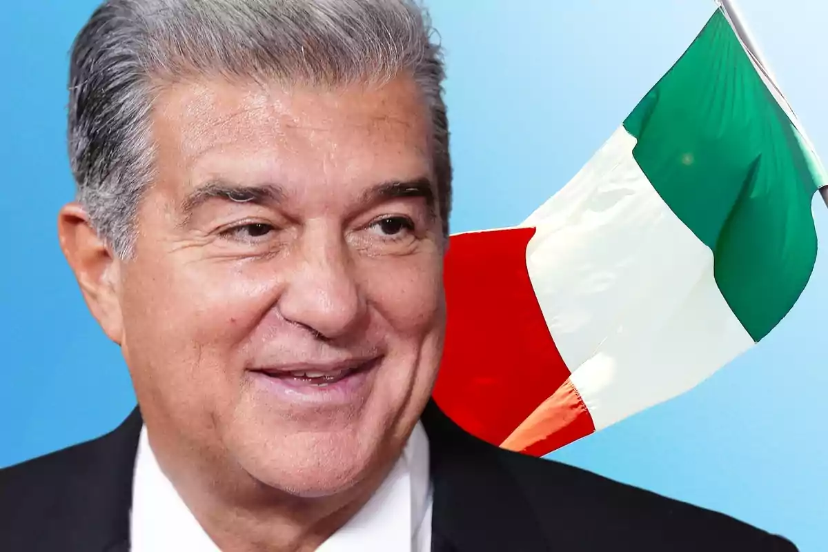 Man smiling with an Italian flag in the background.