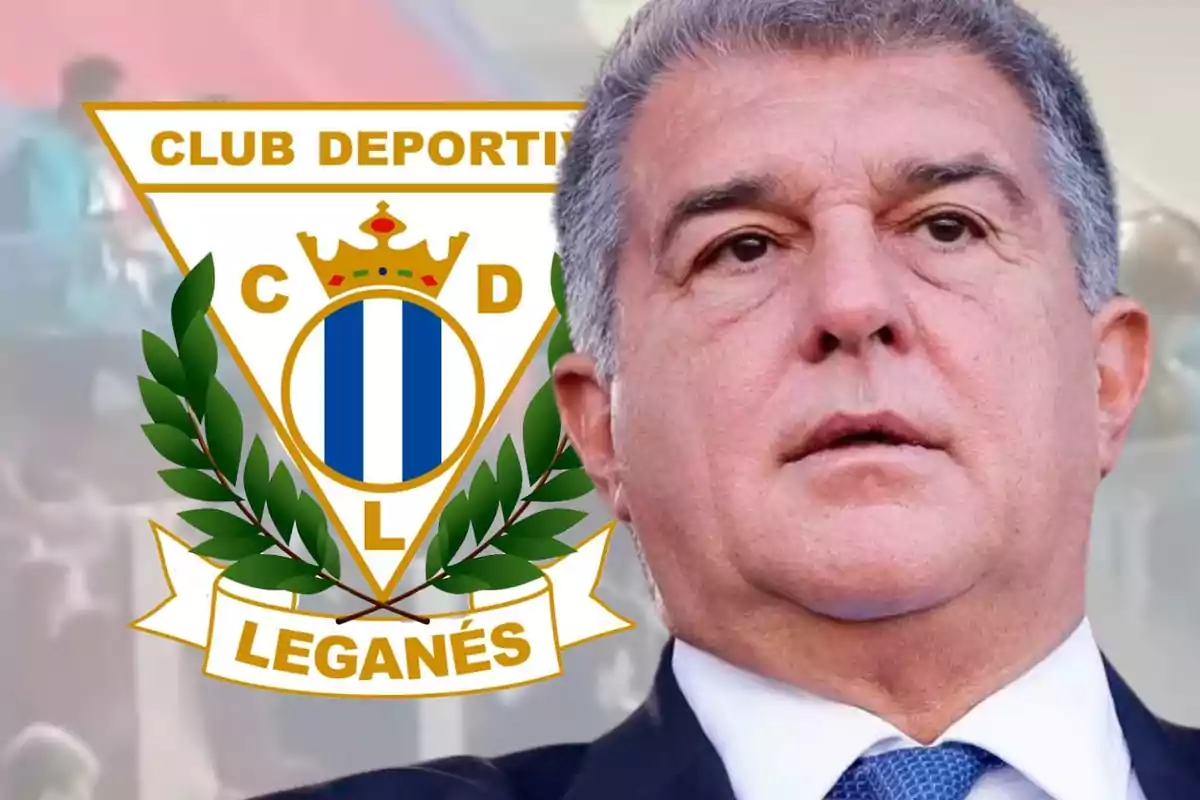 Un hombre en traje aparece frente al escudo del Club Deportivo Leganés.