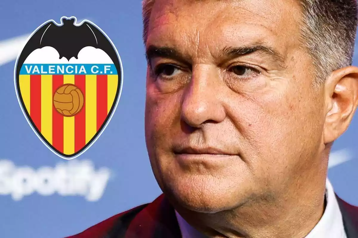 Joan Laporta looking at the Valencia CF shield