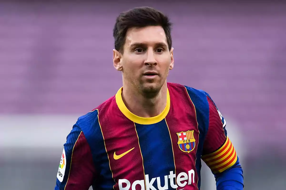 Soccer player wearing an FC Barcelona uniform and a captain's armband during a match Soccer player wearing an FC Barcelona uniform and a captain's armband during a match