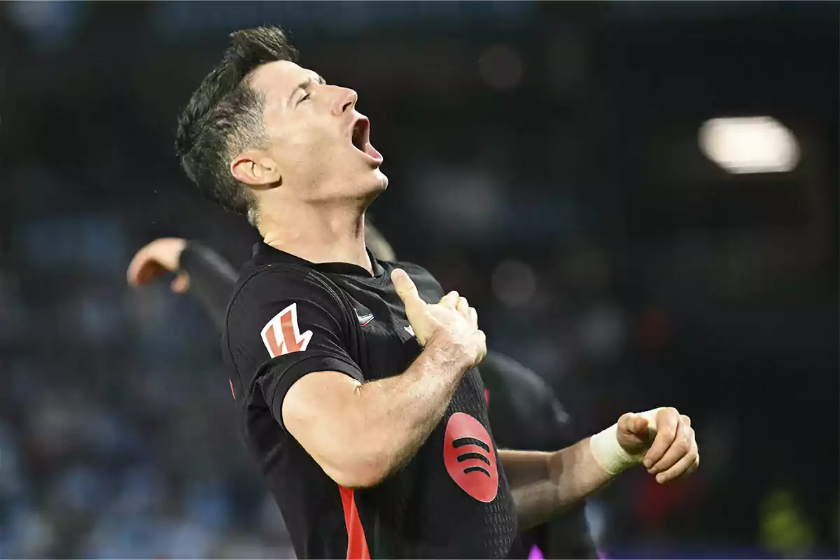 Robert Lewandowski celebrating with excitement on the field.