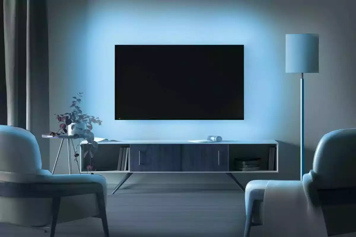 A modern living room with a wall-mounted television, two armchairs, a floor lamp and a side table with a plant. A modern living room with a wall-mounted television, two armchairs, a floor lamp and a side table with a plant.