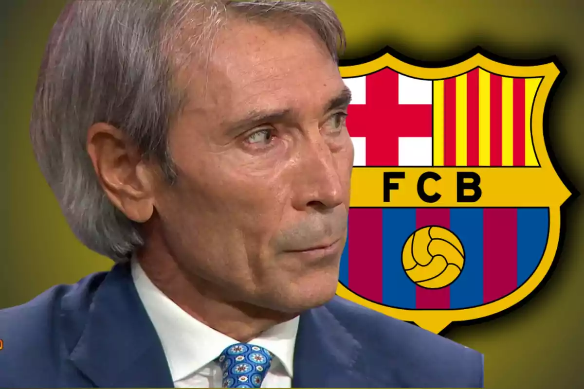 A gray-haired man in a suit and tie is in front of the FC Barcelona crest.